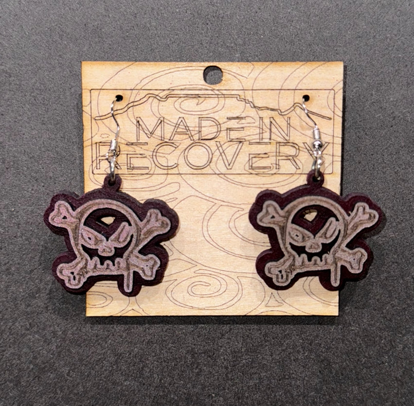 Nickel free laser cut and engraved earrings. Responsible gifting. By buying from us you are supporting men in recovery helping other men off the streets and into recovery. Please support us to support others. Earrings - nickel free. Graffiti style skull