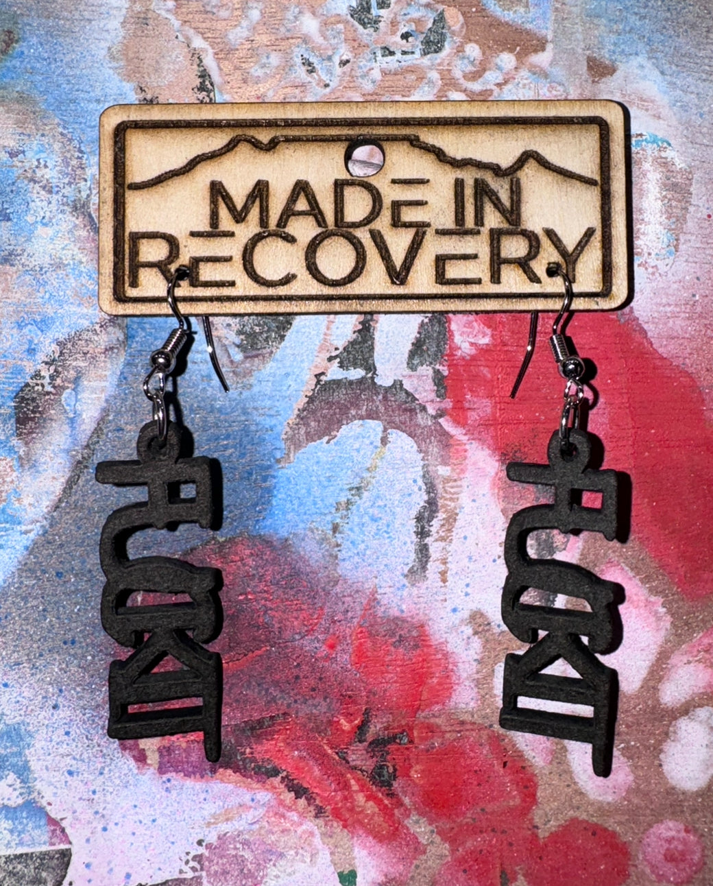 fuckit earrings. Nickel free laser cut and engraved earrings. Responsible gifting. By buying from us you are supporting men in recovery helping other men off the streets and into recovery. Please support us to support others. Sometimes we jut need to say F it and let go.