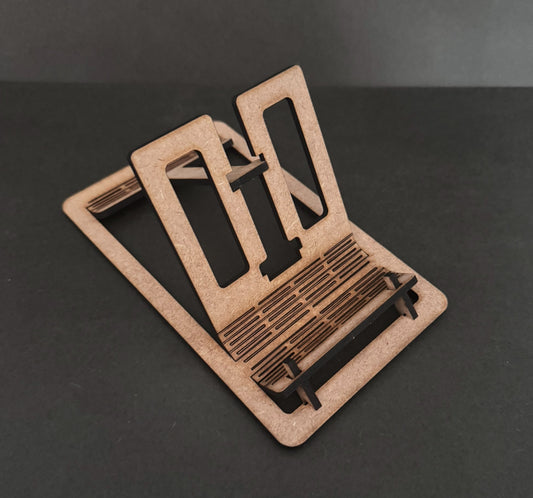 Laser Cut MDF Cell Phone Stand comes flat packed - simply pop &amp; fold to use.Responsible gifting. By buying from us you are supporting men in recovery helping other men off the streets and into recovery. Please support us to support others.